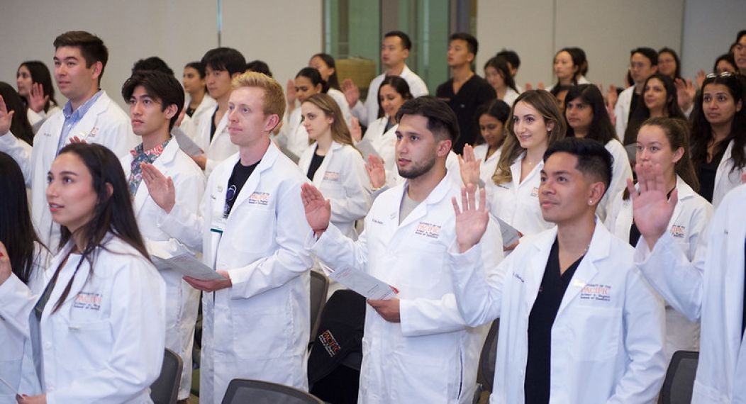 students reciting research oath